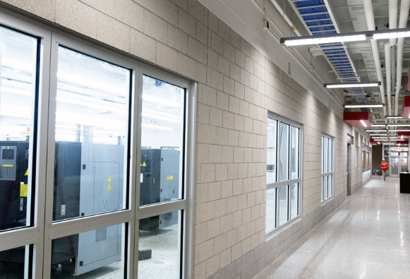 Corridor showing ceiling infrastructure and cable management
